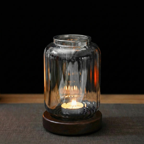 Alternate angle of Wispoak Lantern Warmer on walnut wood surface with tealight lit