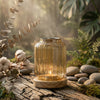 Side profile of Wispoak Vintage Lantern Warmer showing brass mesh crown and glass body